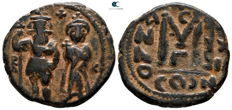 Heraclius with Heraclius Constantine AD 610-641. Constantinople
Follis Æ

25 ...