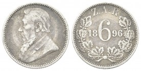 SUD AFRICA
Repubblica. 
6 Pence 1896.
Ag , gr. 2,76
Dr. Busto di Paul Kruger barbuto a s.
Rv. Valore e data entro corona di lauro.
KM#4.
 BB