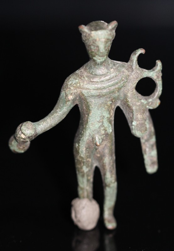 2nd-3rd century AD. Bronze statuette of the god Apollo standing naked except for...