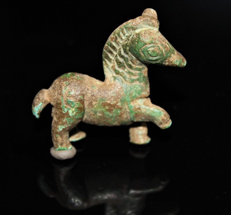 1st century BC to 1st century AD. Bronze horse in a dynamic position with right ...