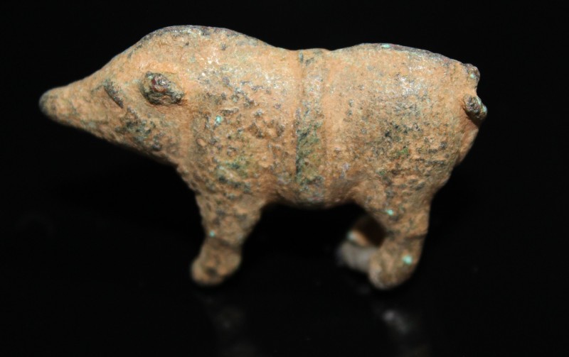 2nd-3rd century AD. Bronze figure of a boar, standing on short legs, one leg mis...