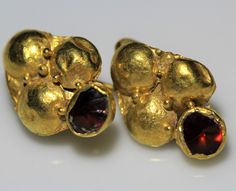 2nd-4th century AD. A pair of gold earrings in the shape of grapes, decorated wi...