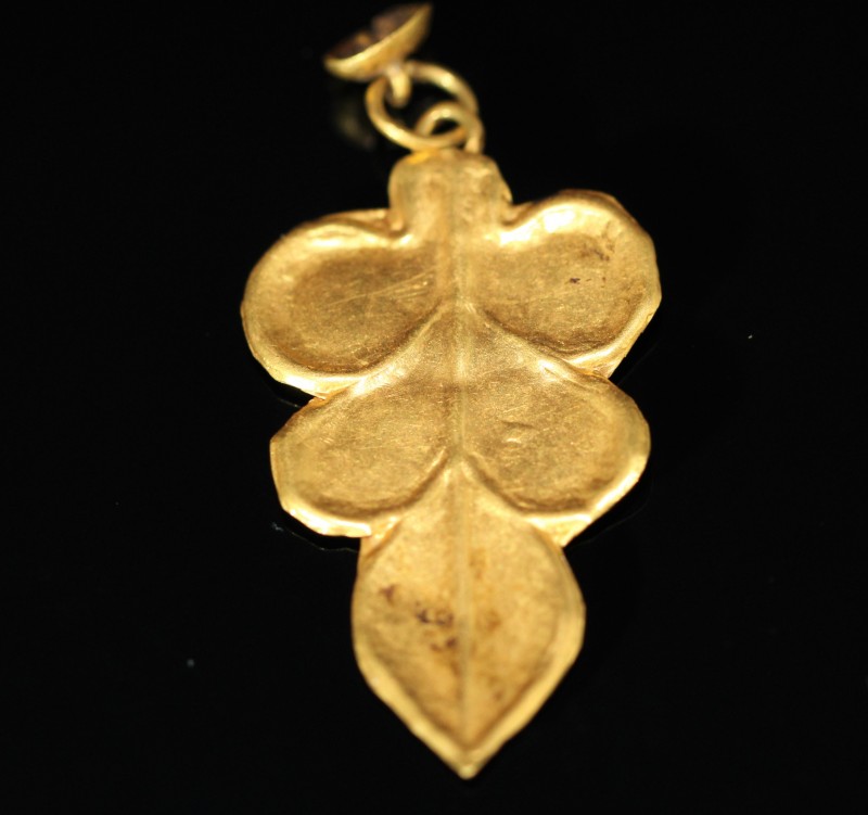 1st-3rd century AD. Fine gold leaf shaped pendant, worked by bending and pulling...