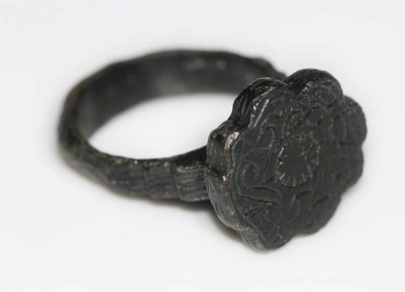 15th-17th century AD. Massive bronze ring lavishly decorated ring and ringplate ...