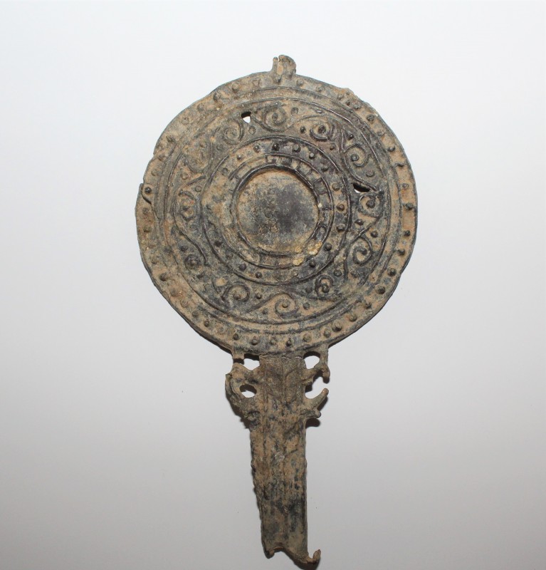 2nd-4th century AD. Lead-alloy mirror with relief floral decoration. Entire mirr...