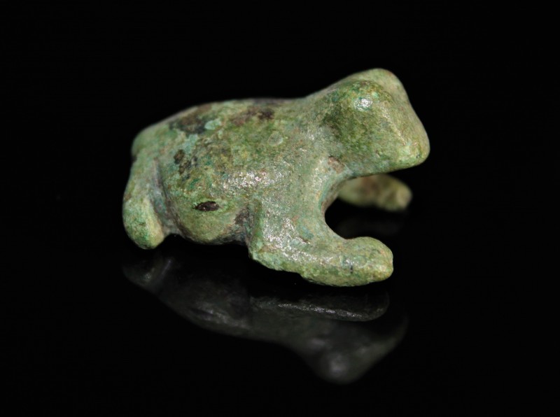Circa 1st millenium BC. Egyptian bronze frog with smooth light green patina, hol...