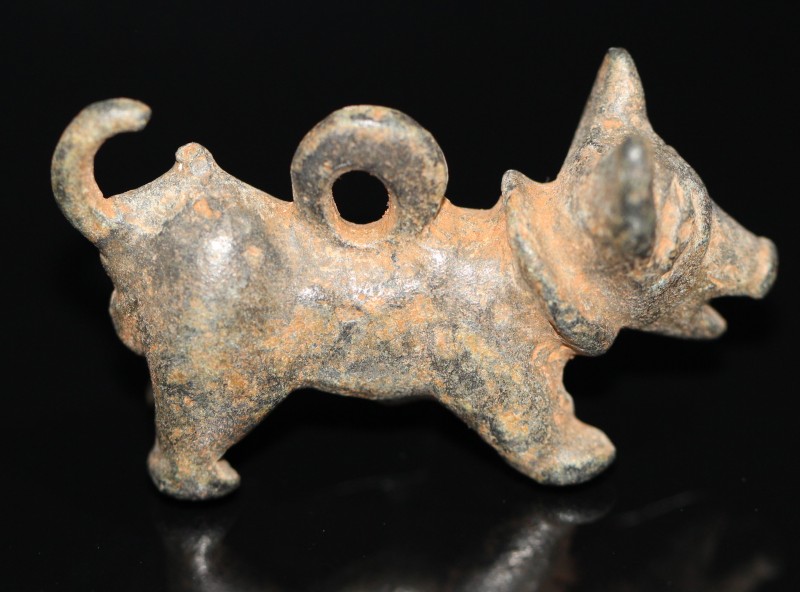 1st century AD. Bronze figurine of a dog with a neck collar, open mouth and a ra...
