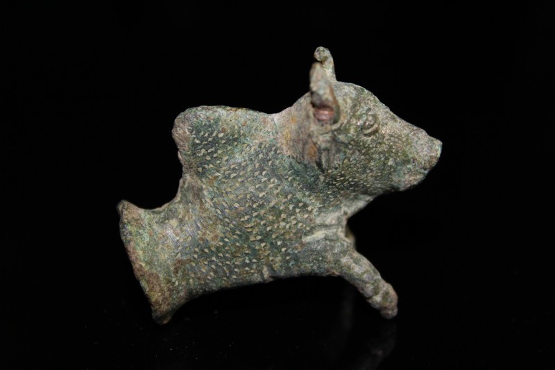 2nd - 3rd century AD. Bronze bull with two front legs outstretched, with an open...