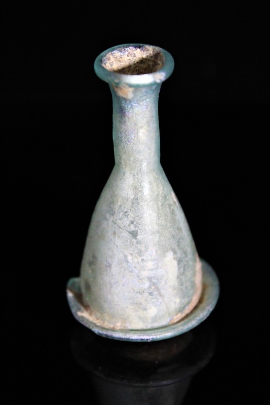 2nd century AD. Iridescent glass vial, with a chipped base, but otherwise in ver...