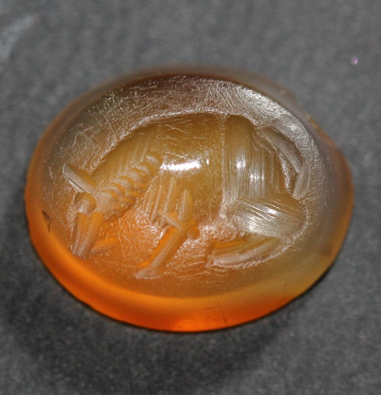 1st century AD. Carnelian intaglio with wolf, boasting very fine detail to the h...