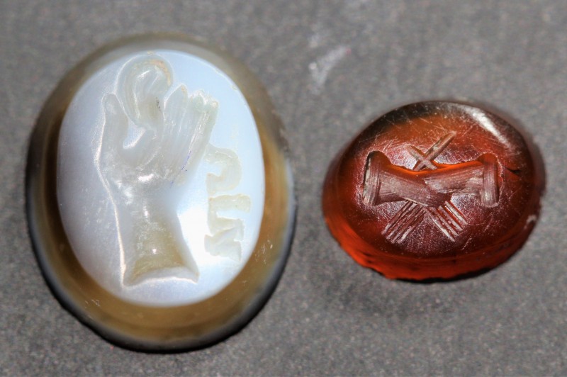 1st century AD. Nicolo-agate intaglio show a large hand holding attribute and in...