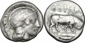 Greek Italy. Southern Lucania, Thurium. AR Stater, 443-400 BC. D/ Head of Athena right, wearing Attic helmet decorated with wreath. R/ Bull butting ri...
