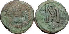 Justinian I (527-565). AE Follis, Constantinople mint, 539-540. D/ Bust of Justinian facing, helmeted, cuirassed; holding cross-globe; to right, cross...