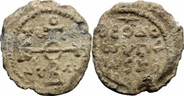 PB Seal, 8th-12th century. D/ Cruciform invocative monogram. R/ Inscription in four lines. Lead. g. 17.30 mm. 27.50 Good VF.
