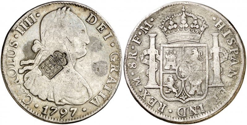 1797. Carlos IV. México. FM. 8 reales. 26,26 g. Resello escudo de Portugal (de M...