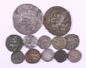 Lote de 12 monedas islámicas, la mayoría tipo quirate, alguna en cobre. A examinar. MBC-/MBC+.