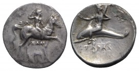 Southern Apulia, Tarentum, c. 280-272 BC. AR Nomos (22mm, 6.47g, 5h). Youth on horseback r., crowning self; ΣΩ to l., ΞAΛO and Ionic capital below. R/...