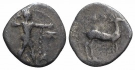Bruttium, Kaulonia, c. 425-420 BC. AR Diobol (11mm, 0.96g, 12h). Nude Apollo walking r., holding branch in raised r. arm. R/ Stag standing r.; ivy lea...