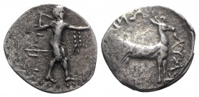 Bruttium, Kaulonia, c. 400-389/8 BC. AR Stater (23mm, 7.40g, 6h). Apollo advancing r., holding branch, fillet hanging over extended l. arm; bird trap ...