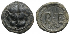 Bruttium, Rhegion, c. 450-425 BC. Æ Onkia (13mm, 1.58g, 11h). Lion mask facing. R/ R E; sprig of olive leaves between. HNItaly 2517; SNG ANS 679. Gree...