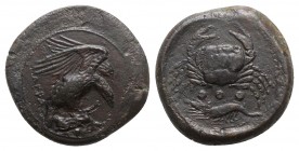 Sicily, Akragas, c. 415-406 BC. Æ Tetras – Trionkion (23mm, 10.24g, 7h). Eagle, wings raised, standing r. on, and tearing at, dead hare. R/ Crab; belo...