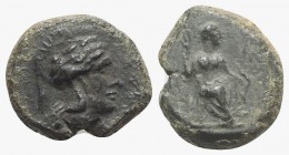 Sicily, Athl-, c. 344-339 BC. Æ (13mm, 3.31g, 9h). Helmeted head of Athena r. R/ Female figure seated r., holding trident(?) in r. hand, grounded bow ...