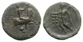 Sicily, Himera, c. 425-409 BC. Æ Hemilitron (21mm, 6.99g, 6h). Pan, blowing into conch shell and holding lagobolon, riding goat springing r.; helmet b...