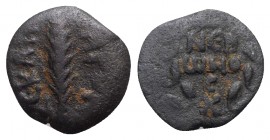 Judaea, Procurators. Porcius Festus (59-62 CE). Æ Prutah (16.5mm, 2.27g, 11h). Jerusalem, year 5 of Nero (58/9). Legend within wreath. R/ Palm branch....
