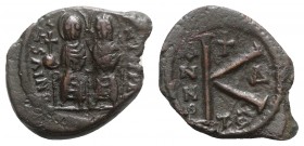 Justin II and Sophia (565-578). Æ 20 Nummi (24mm, 6.03g, 6h). Thessalonica, year 5 (569/70). Nimbate figures of Justin and Sophia seated facing on dou...