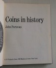 Porteous J. Coins in History. G.P. Putnam's Sons. New York 1969. Mezza Pelle con titolo in oro al dorso, pp. 251, ill. in b/n e a colori. Buono stato