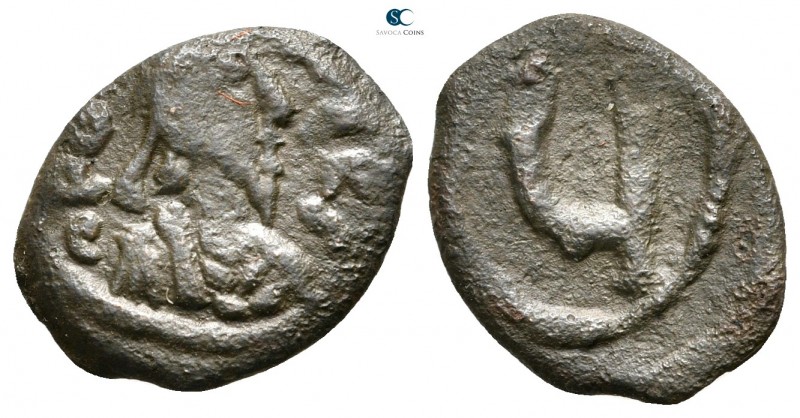 Phocas AD 602-610. Constantinople
Pentanummium Æ

15 mm., 1,32 g.



very...
