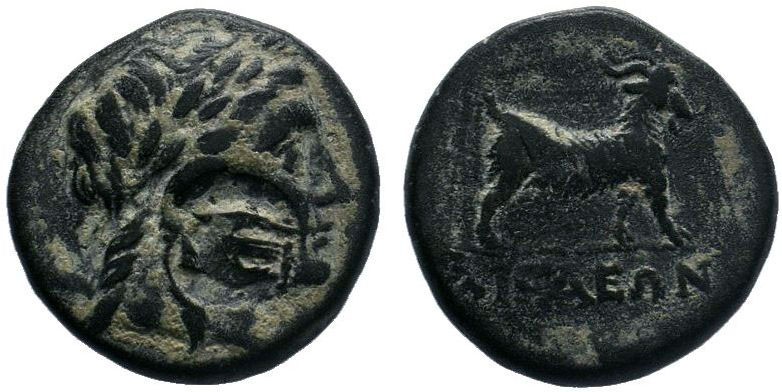 Aeolis. Aigai circa 300-200 BC. AE Bronze.Head of Apollo right / AIΓAEΩN, goat s...