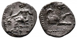 Cilicia, uncertain mint AR Obol. 4th century BC. Baaltars seated left, holding grain ear, grapes and sceptre / Forepart of wolf right; crescent above....