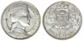 Latvia 5 Lats 1929. Obv: Maiden's head facing right in stylized folk costume. including headdress. with ears of grain over her shoulder. Rev: Latvian ...