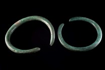 Bronze Age, Pair of Bronze Penannular Bracelets, c. 2nd Millennium BC (12.4cm). Heavy armlets, green patina.
