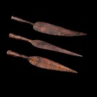 Late Iron Age, lot of 3 Iron Spearheads, c. 12th-11th century BC (30-32cm). Rusty patina, slightly chipped.
