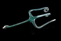 Iron Age, Bronze Applique in form of a Trident with spirally curled endings, c. 9th-6th century BC (14cm). Attractive green patina, intact.