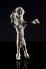 Oriental Greek, Bronze cast figure. c. 6th century BC (8cm). Naked female figure with raised hands and holding two objects. Brown green patina, minor ...