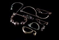 Lot of 9 Bronze Fibulae of different types between them two fibulae of the Early Latène Scheme. 8th - 1st century B.C. Green-brown patina, intact.