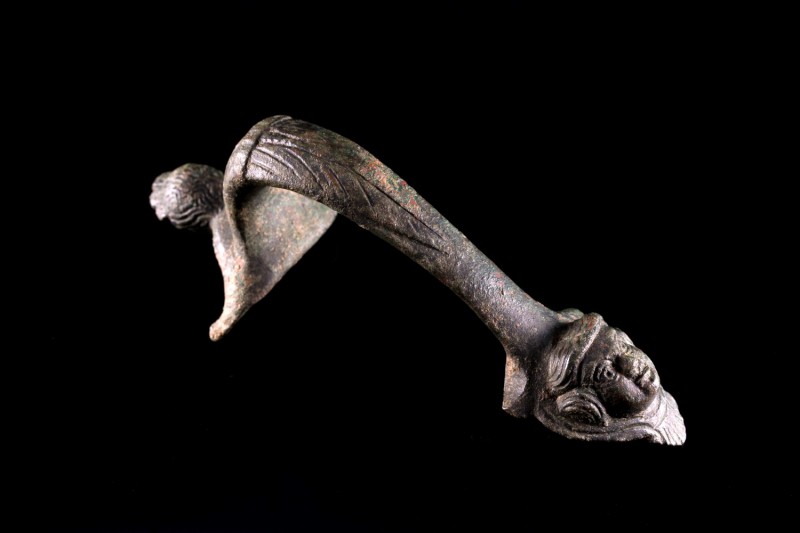 Roman Bronze Ewer Handle, c. 1st century AD (11,7cm). Decorated with a female he...