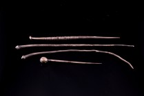 Lot of 4 Roman Silver Dress Pins, c. 2nd-3rd century (11.3-14.3cm). Two with biconical finial; one with globular finial; one with decorated shaft. Goo...