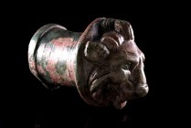 Roman Bronze Axle Cap in form of lion head, c. 2nd-3rd century AD (9,8x7,2cm). Intact, expect small perforation on cheek. Green patina.