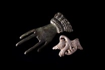 Lor of 2 Roman Bronze and silvered Brooches, c. 3rd-4th century AD, in form of open hand (7.5cm; pin and one finger missing) and eagle standing r., he...