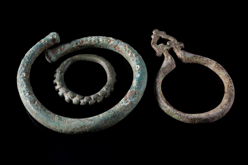 Lot of 3 Roman Bronze fittings and one torque. c. 3rd-4th century AD. Green pati...