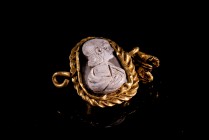 Roman Gold Pendant with Cameo depicting a Female draped bust right, c. 3rd century AD (2cm). Good condition, cameo fragmented.