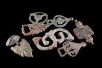 Lot of 7 Roman Bronze Fittings and Belt Buckles. c. 3rd-4th century AD. Different types and some with incised decorations. Green patina and minor depo...