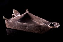 Roman Bronze triangular open Lamp, c. 3r-4th century AD (15cm), with flat base, basal ring and loop handle. Intact.