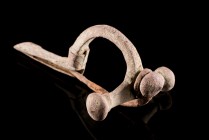 Roman Bronze Crossbow Fibula, 3rd-4th century AD (8.3cm). Heavy brooch with three knobs, long foot decorated with pellet-in-circle designs. Intact wit...