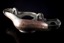 Roman Bronze Lamp with two nozzles in form of Duck Head, c. 4th-5th century AD (24cm). Nice green patina, small perforation, otherwise intact.