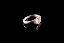 Roman Silver Finger Ring, engraved with three standing figures holding axe, c. 4th-5th century AD (2cm).